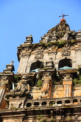 Top of Cathedral of Santiago de Compostela facade with blue sky