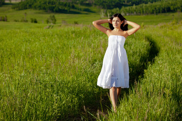 woman walking along the road