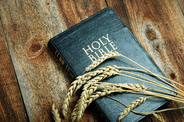 Bible and Wheat  on Wood background