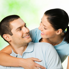 Portrait of young happy couple, outdoors