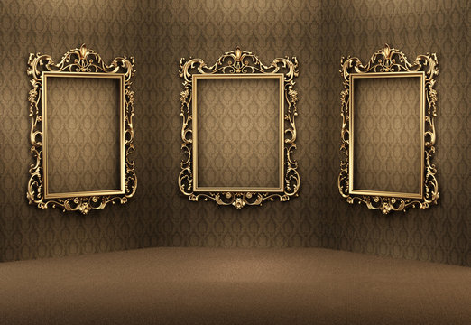 Empty golden frames on the wall in luxurious interior