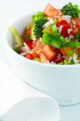 Rice salad with pepper and broccoli flavored with basil