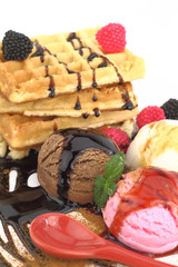 Waffles with vanilla, strawberry and chocolate ice cream