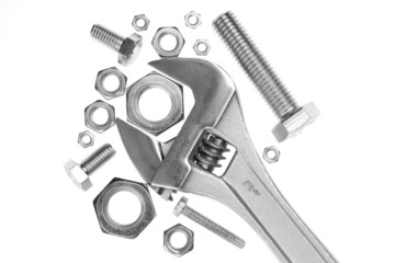 Adjustable wrench with nuts and screws