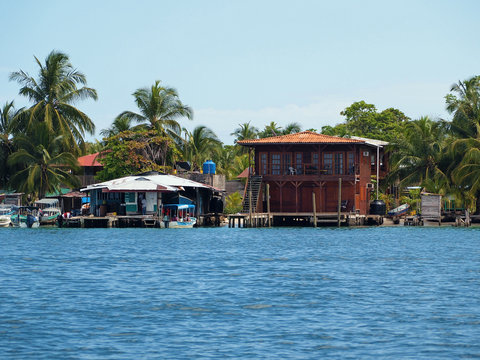 Tropical coast with a Caribbean house and a small fuel station for boats, archipelago of Bocas del Toro, Carenero island, Panama, Central America
