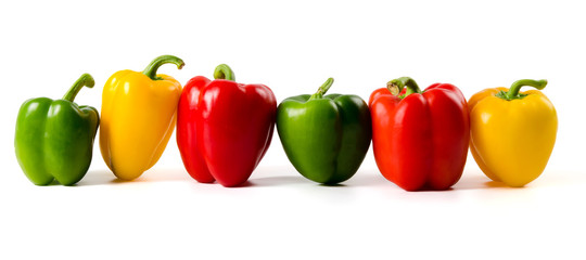 A lineup of colored peppers