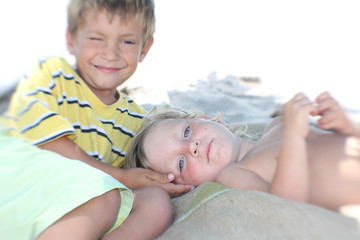 brother and sister partly isolated over white