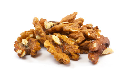 Crushed walnuts on white background
