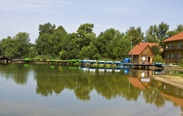 Fototapeta na wymiar Wooden houses near water