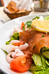 Fresh salmon salad with tomatoes