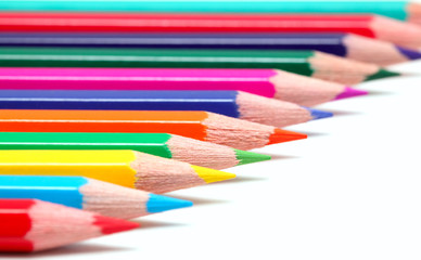 Fototapeta premium Colorful pencils on white surface