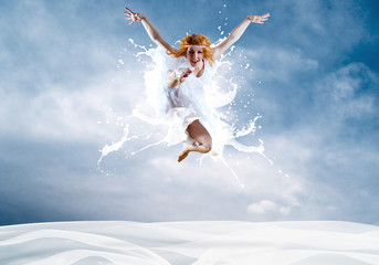 Naklejka premium Jump of ballerina with dress of milk