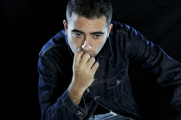 Man thinking with black background 