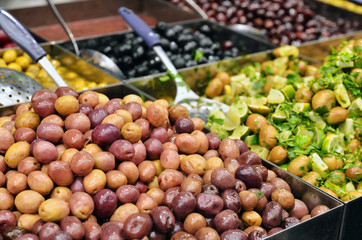 olives, pickles and salads on market stand