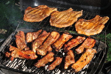 Spareribs and Grilled steaks on the grill
