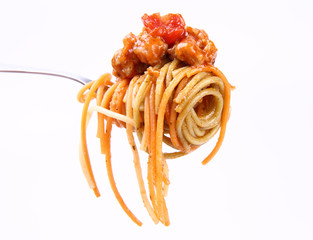 Spaghetti with bolognese sauce hanging on a fork