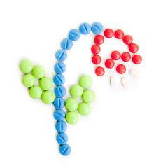 Flawor made of Pills isolated on white background