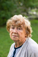 Portrait of a sad senior woman outdoor