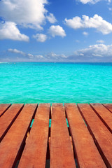 Caribbean wood pier with turquoise aqua sea