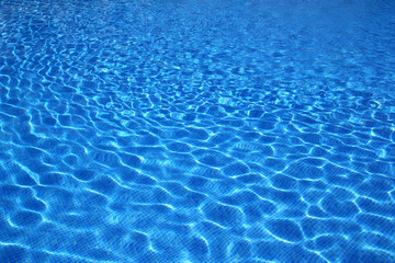 Obraz premium blue tiles swimming pool water reflection texture