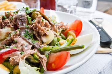 Fresh salmon salad with tomatoes