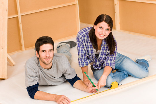 Home improvement young couple work on renovations