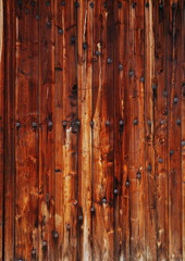 brown wooden wall with metal nails