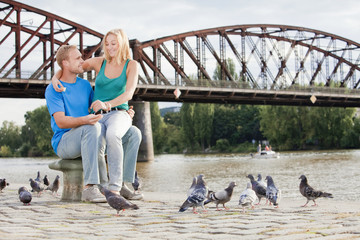 couple feeding birds