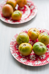 Green Tomatoes on a Red Plate