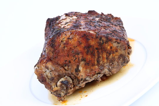 Roast pork on a white plate