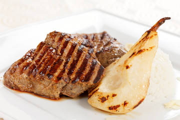 Grilled pork steak with pear