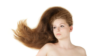 Fototapeta premium Healthy beautiful long hair closeup in motion created by wind