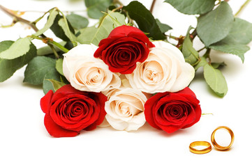 Wedding concept with roses and rings