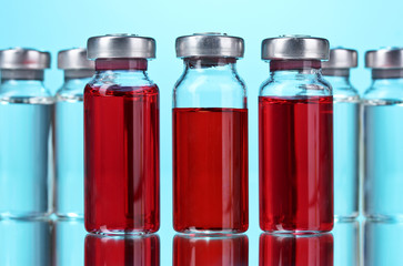medical ampoules on blue background