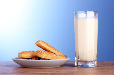 cookies with milk on blue background