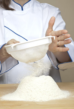 Flour sifting (shot of flour falling through the sieve)