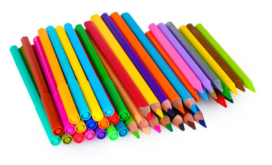 Bright markers and crayons isolated on white
