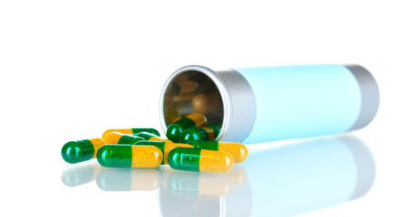 Bottle and pills isolated on white