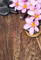 Tropical spa concept with Plumeria flower and pabble stone