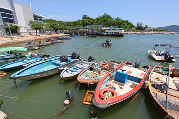 Obraz premium Fishing boats along the pier in Hong Kong