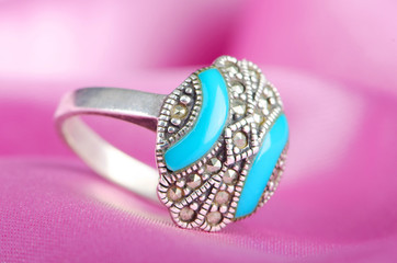 Fashion concept with ring on background