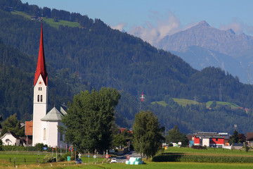 Fototapeta na wymiar Typical view of the Alps with church, Inn valley, Austria