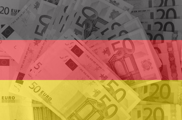 flag of Germany with transparent euro banknotes in background