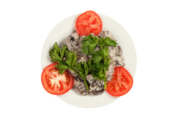 Mushrooms, fried with sour cream on a white plate