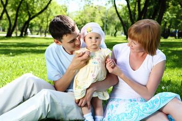 Young family together in the park