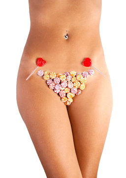 The girl in bikini from sweets, on a white background