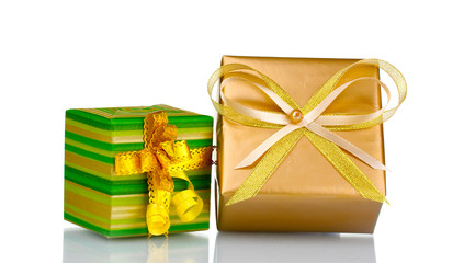 Beautiful bright golden and green gifts isolated on white