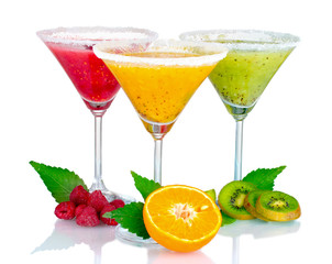 Delicious fruit smoothies and fruit isolated on white
