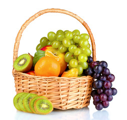 Ripe juicy fruits in  basket isolated on white