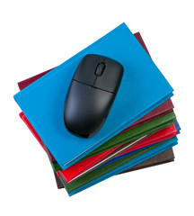 Books with computer mouse isolated on white background.